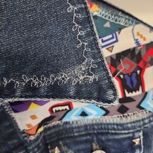 Blue Jean Jacket with Decorative Stitching and Dark Denim Fabric